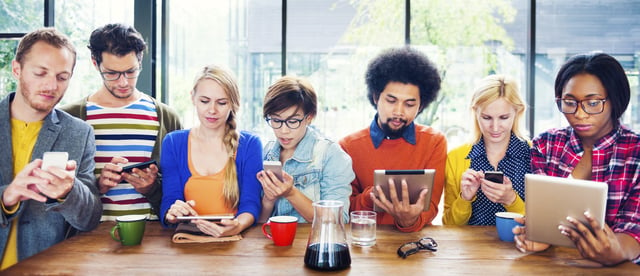 Image showing a group of millennials on electronic devices